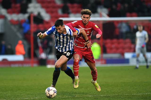 Doncaster Rovers' Josh Martin battles with Wednesday's Jordan Storey Picture: Jonathan Gawthorpe