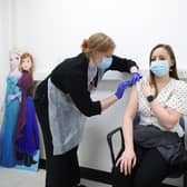 Holly Fox (right) receives a Moderna Omicron COVID-19 booster vaccine in a clinical study at St George's, University of London, (PA)