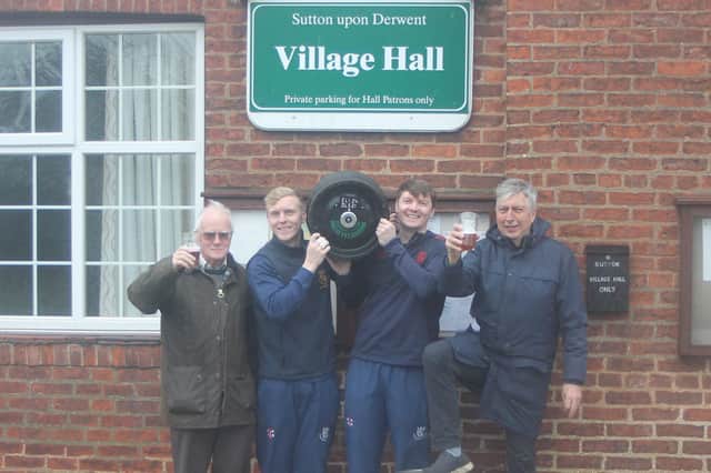 Sutton Village Hall chairman John Newlove, Woodhouse Grange cricketers Chris and Andrew Bilton, and Woodhouse Grange chairman Martin Smith prepare for the Sutton Beer Festival.