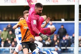 Hull City goalkeeper Matt Ingram (top middle) clashes with QPR's Albert Adomah leading to him being taken off injured at Loftus Road. Picture: Jacques Feeney/PA Wire