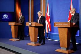 Chief medical officer Sir Chris Whitty, Prime Minister Boris Johnson and Chief scientific adviser Sir Patrick Vallance during a media briefing in Downing Street, London, to outline the Government's new long-term Covid-19 plan