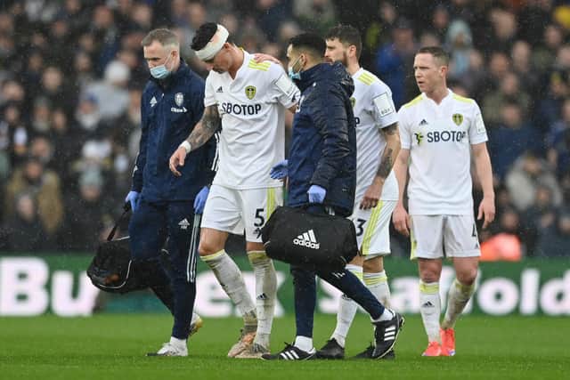 Robin Koch of Leeds United receives medical treatment. Picture: Shaun Botterill/Getty Images