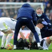 CONTROVERSY: Leeds United's medical staff treat Robin Koch during the game against Manchester United