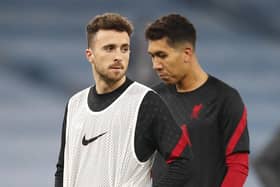 RULED OUT: Diogo Jota, left, and Roberto Firmino, right. Picture: PA Wire.