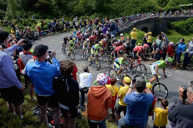 The riders climb up Grinton Moor during the Stage One of Le Tour de France on July 5, 2014 in Harrogate, England. (Photo by Gareth Copley/Getty Images)