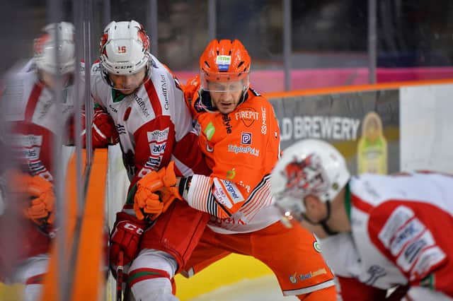 Jonathan Phillips battles on the boards during Sheffield Steelers' Sunday night Elite League clash with Cardiff Devils. Picture: Dean Woolley/EIHL.