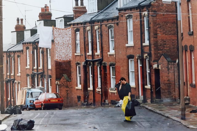 The photo is dated July 1992 and appears to show bins and rubbish being collected but where was it taken?