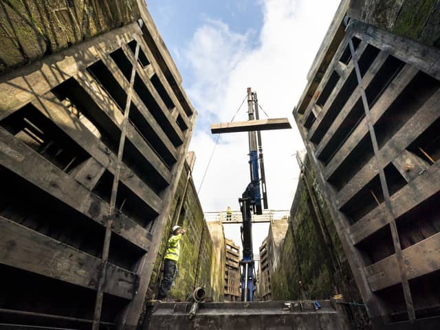 Engineers from the Canal and River Trust replace Britain's tallest set of lock gates at Bingley Five Rise Locks