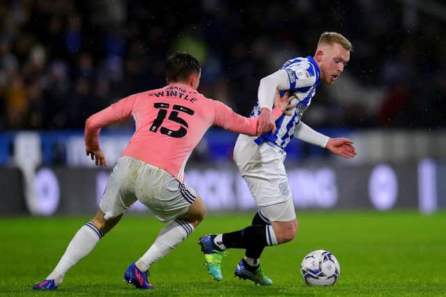 Cardiff City's Ryan Wintle (left) and Huddersfield Town's Lewis O'Brien battle for the ball (Picture: Simon Marper/PA)