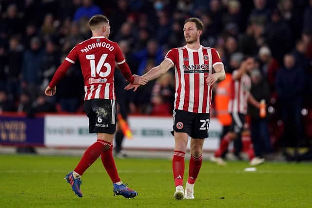 Sheffield United's Ben Davies (right) celebrates scoring the winning goal with Oliver Norwood (Picture: PA)