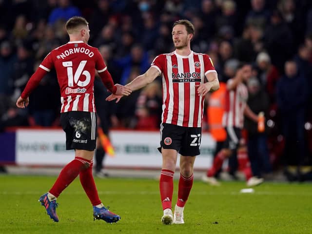 Sheffield United's Ben Davies (right) celebrates scoring the winning goal with Oliver Norwood (Picture: PA)