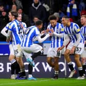 Huddersfield Town's Jon Russell celebrates with his team-mates after scoring their side's second goal of the game (Picture: Simon Marples/PA)