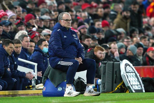 Leeds United manager Marcelo Bielsa sits on the touchline during the Premier League match at Anfield (Picture; PA)