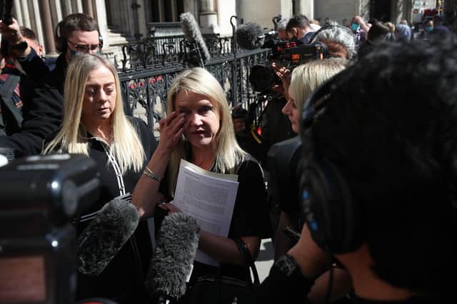 Former post office worker Janet Skinner (centre) speaks to the media outside the Royal Courts of Justice, London, after having her conviction overturned by the Court of Appeal. Thirty-nine former subpostmasters who were convicted of theft, fraud and false accounting because of the Post Office's defective Horizon accounting system have had their names cleared by the Court of Appeal.