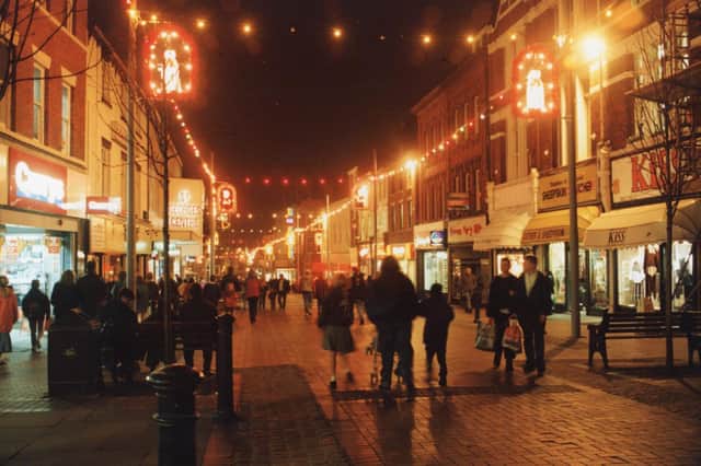 Christmas shopping in Friargate, Preston. This image was captured in 1994. None of the shops you see here are still on the high street today