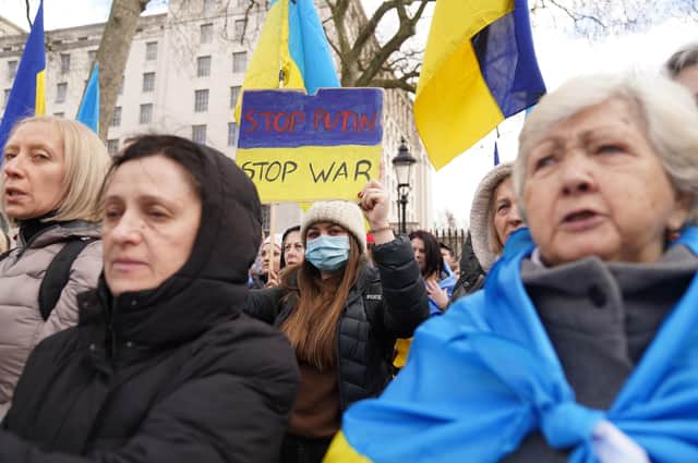 Ukrainians hold a protest against the Russian invasion of Ukraine outside Downing Street as the free world comes to terms with the escalating crisis.
