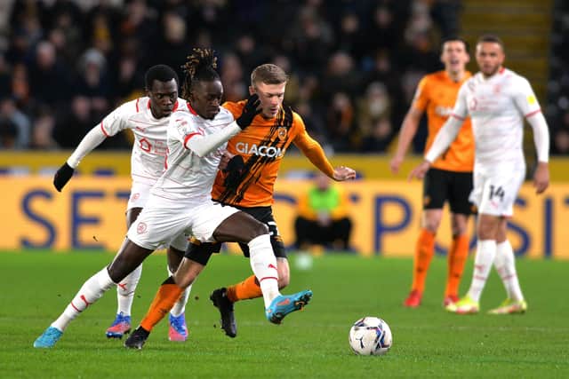 Domingos Quina takes on Regan Slater as Hull City lost to Barnsley. (Picture: Bruce Rollinson)