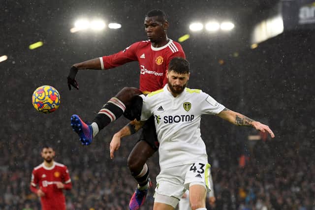 Leeds United's Mateusz Klich is challenged by Manchester United's Paul Pogba. (Picture: Simon Hulme)