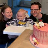 Nichola and Greg celebrating with Oscar on his first birthday and her completion of 310,000 steps on March 31 last year.