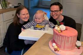 Nichola and Greg celebrating with Oscar on his first birthday and her completion of 310,000 steps on March 31 last year.