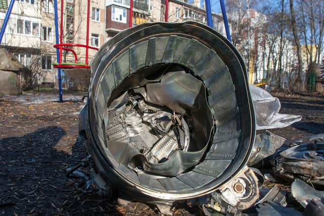 Fragments of military equipment lies on the street the aftermath of an apparent Russian strike in Kharkiv in Kharkiv.