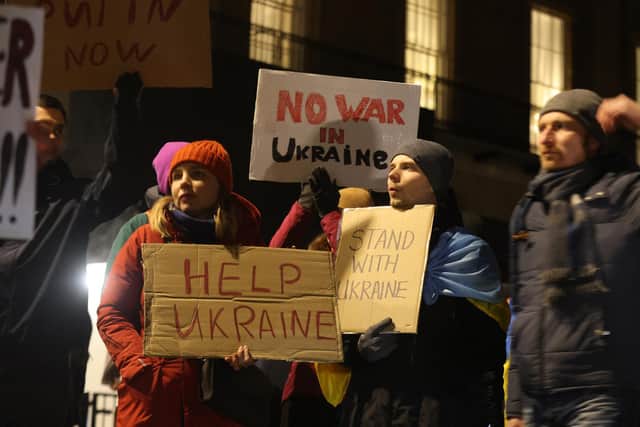 Ukrainians holding a protest against the Russian invasion of Ukraine outside Downing Street