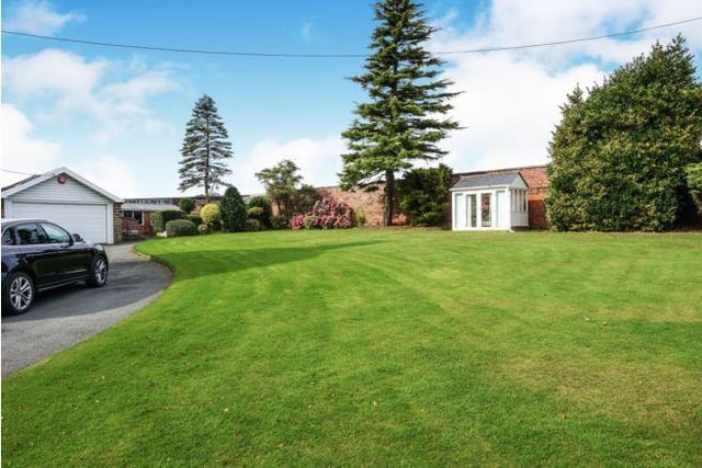 Set in approximately 3/4 of an acre garden and grounds, this impressive family home is set well back from the main road and enjoys a rural setting with farmland views.