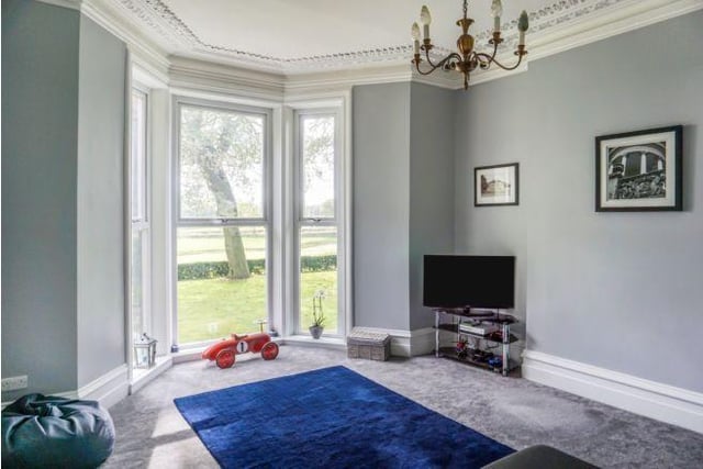 Another reception room offers more great views over the garden.