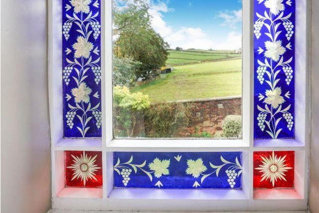 The property has quirky features like these stunning stained glass windows.
