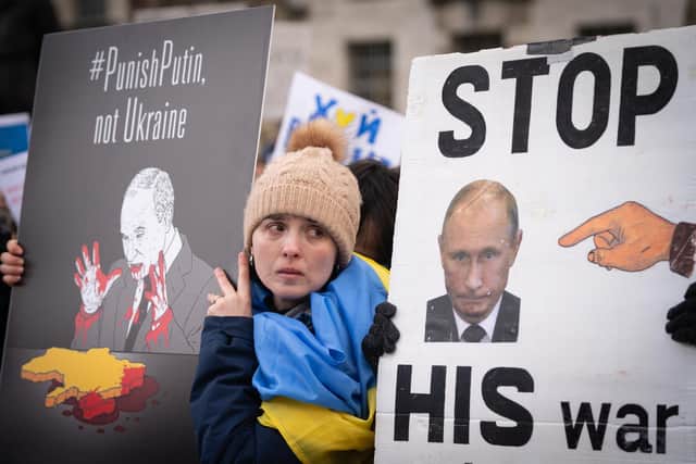 Ukrainians hold a protest against the Russian invasion of Ukraine outside Downing Street, central London .