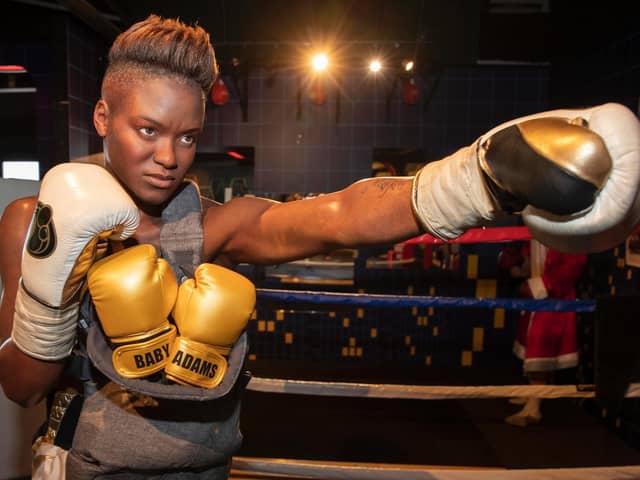Madame Tussauds have gifted Nicola Adams a tiny pair of gold boxing gloves after the Leeds Olympian announced she and partner Ella are expecting a baby.