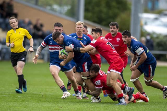 From the kitchen to rugby field: Sam Graham, centre, in action for Doncaster Knights who he is hoping to captain to a place in the Premiership next season. (Picture: Tony Johnson)