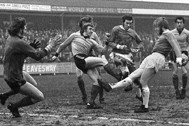 Ian Ledgard has the ball taken off his toe as he joins the action with Joe Fletcher in the Boston United area in the Northern Premier League fixture at Springfield Park on Saturday 8th of January 1972. The match was a 0-0 draw.