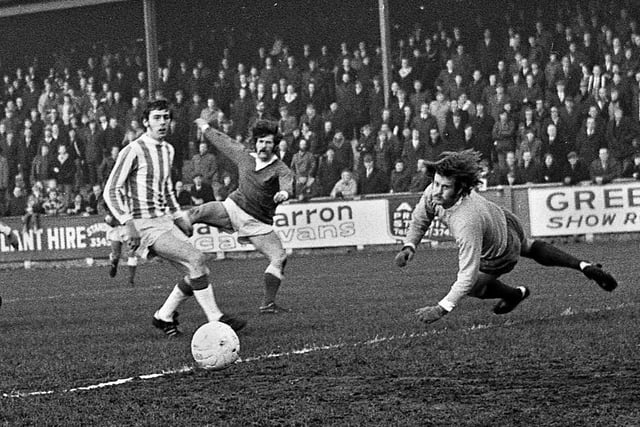 Johnny King fires wide against Runcorn with goalscorer, John Rogers, watching in a Northern Premier League match at Springfield Park on Saturday 30th of December 1972. Latics won 3-0 with Micky Worswick, Graham Oates and John Rogers scoring the goals.