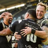 VICTORY: Chris Satae of Hull FC is surrounded by teammates including Adam Swift (R) and Ligi Sao (L) after scoring a try against Salford Red Devils. Picture: Will Palmer/SWpix.com
