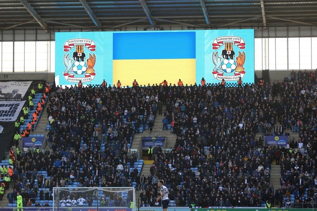 The scoreboard displays the Ukraine flag above the PNE fans at kick-off