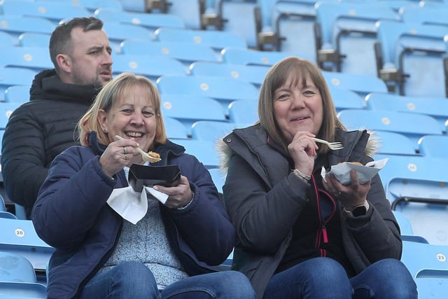 These two North End fans look to be enjoying their pre-match pie