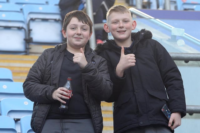 Two Preston fans get ready to support their side at Coventry