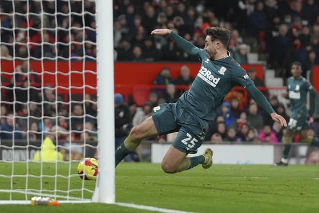 Middlesbrough's Matt Crooks scores his side's opening goal during the English FA Cup fourth round soccer match between Manchester United and Middlesbrough at Old Trafford stadium in Manchester, England. (AP Photo/Jon Super)