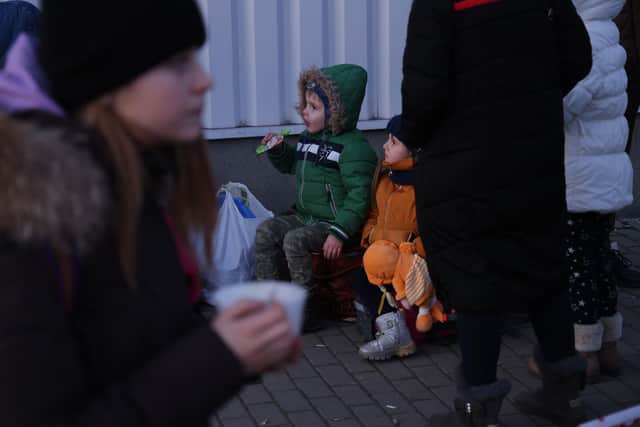 As your own children see Ukranian children impacted by the Russian invasion of war, it is important for parents to be ready to answer their questions. (Photo by Sean Gallup/Getty Images)