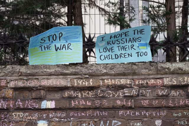 Anti-war placards and graffiti on the walls of the Russian Embassy in Kensington Palace Gardens, west London, to denounce the Russian invasion of Ukraine.