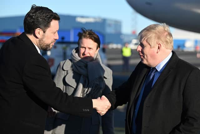 Prime Minister Boris Johnson is greeted by Ambassador to Estonia, Ross Allen as he arrives at Tallinn Airport, Estonia