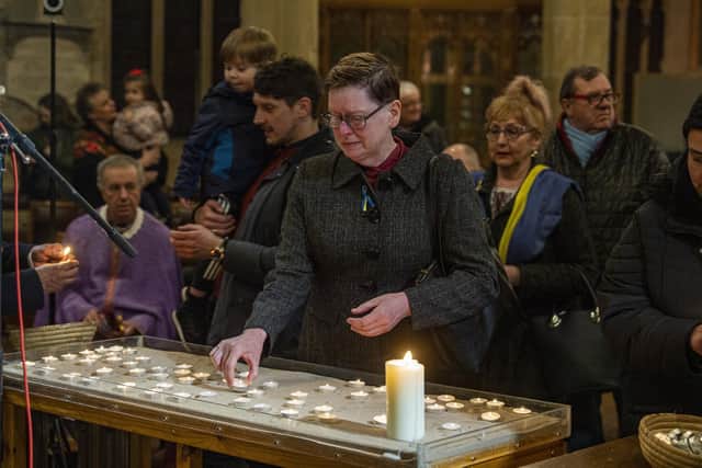 Tears from a member of the public whilst lighting candles at a peace vigil held at Bradford Cathedral.  Picture Tony Johnson