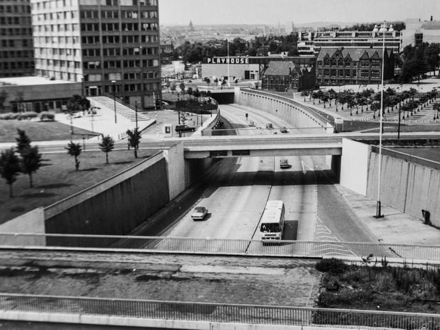 A more modern Leeds, with flyovers and cars driving on the streets. The Playhouse is in the background.