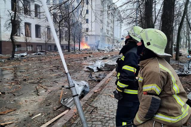 Handout photo dated 02/03/22 issued by State Emergency Service of Ukraine of firefighters tackling a blaze at a Kharkiv University faculty building caused by a Russian missile strike