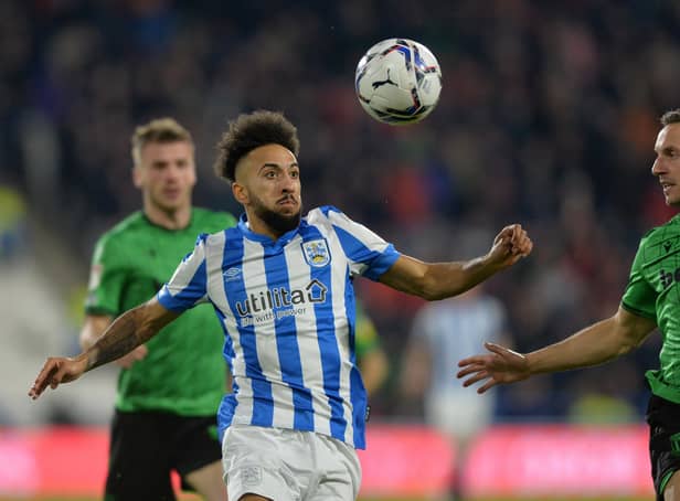 AMBITIOUS: Huddersfield Town's Sorba Thomas battles for possession with Stoke City's Phil Jagielka. Picture: Bruce Rollinson