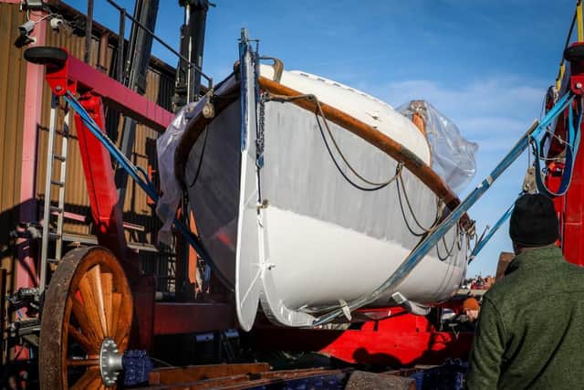 The old rowing lifeboat is carefully lifted into position.
Credit: RNLI/Ceri Oakes