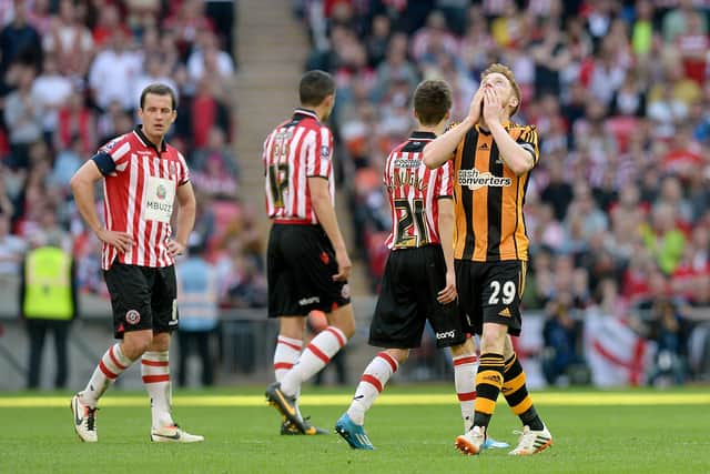 Flashback to 2014 as Hull City's Stephen Quinn (right) celebrates scoring their fourth goal against Sheffield United in the FA Cup Semi-final at Wembley. Picture: PA.