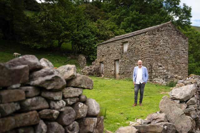 Estate agents Marcus Alderson out valuing property in the Yorkshire Dales