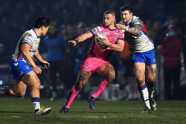 Wakefield Trinity v Leeds Rhinos.
Rhinos Jack Walker is tackled by Trinity's Jay Pitts.
3rd March 2022.
Picture : Jonathan Gawthorpe